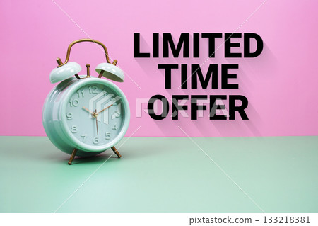 Black alarm clock on a pastel green and pink background with the text "Limited Time Offer" Black alarm clock on a pastel green and pink background with the text "Limited Time Offer" 133218381