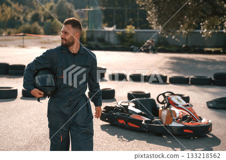 Having a walk, taking a break. Man is outdoors, kart racing conception Having a walk, taking a break. Man is outdoors, kart racing conception 133218562