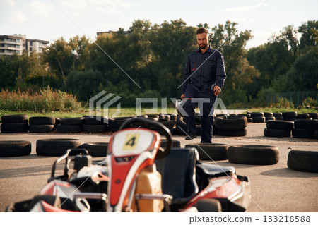 Man is outdoors, kart racing conception 133218588
