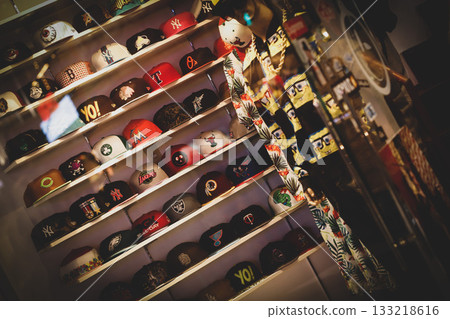 A display of street style caps in a vintage clothing store A display of street style caps in a vintage clothing store 133218616