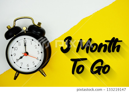 3 Month To Go text and alarm clock on yellow background 133219147