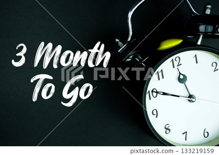 3 Month To Go text and alarm clock on black background 133219159