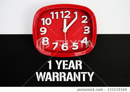 1 Year Warranty text and alarm clock on black and white background 133219169