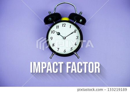 Impact Factor text and alarm clock on purple background 133219189