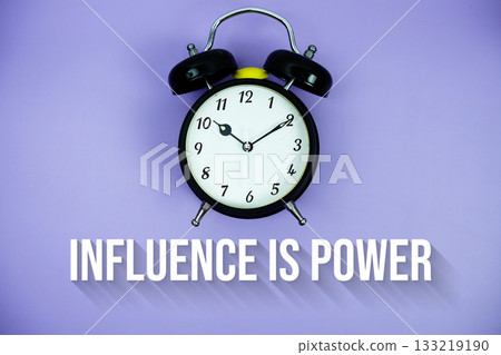 Influence Is Power text and alarm clock on purple background Influence Is Power text and alarm clock on purple background 133219190