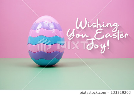 Easter Egg with text "Wishing You Easter Joy!" on pink and green background Easter Egg with text "Wishing You Easter Joy!" on pink and green background 133219203