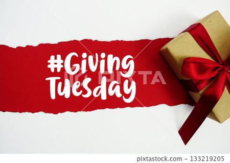 Giving Tuesday text with gift box present on red background 133219205
