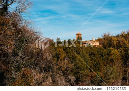 Ancient monastery nestled in autumn forest landscape under blue sky. Monasterio de Piedra Ancient monastery nestled in autumn forest landscape under blue sky. Monasterio de Piedra 133219285