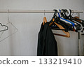 Variety of Empty Hangers on Clothes Rack Display 133219410