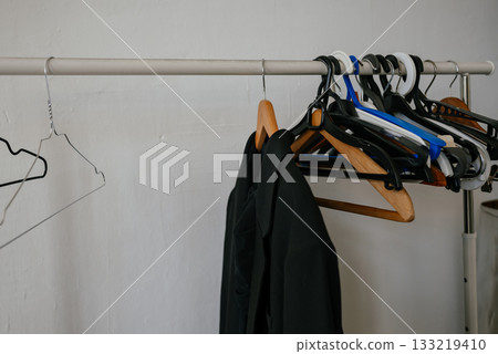 Variety of Empty Hangers on Clothes Rack Display Variety of Empty Hangers on Clothes Rack Display 133219410