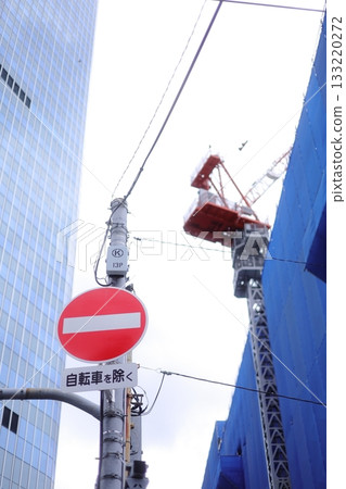 Buildings and road signs seen from below 133220272