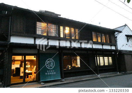 An evening view of a townhouse that seems to have slipped back in time 133220330