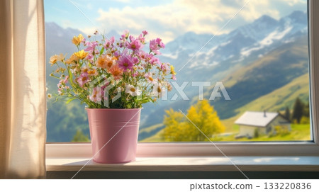 Fresh floral bouquet in pot on window ledge overlooking green hills and mountains 133220836