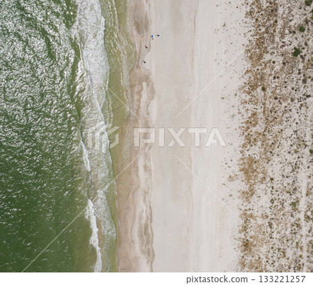 sandy beach on the seashore, view from above sandy beach on the seashore, view from above 133221257