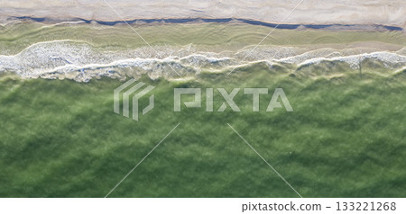 sandy beach on the seashore, view from above sandy beach on the seashore, view from above 133221268