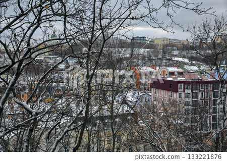 Winter view of colorful buildings in Podil district, Kyiv, Ukraine. Winter view of colorful buildings in Podil district, Kyiv, Ukraine. 133221876