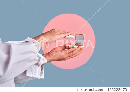 Hands holding compact powder and mirror 133222473