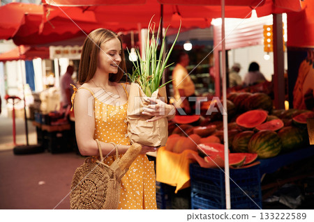 Young woman is on the vegetable market or bazaar 133222589
