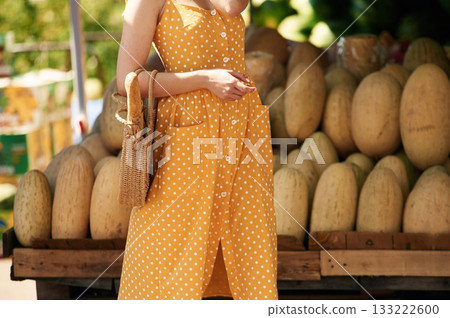 Young woman is on the vegetable market or bazaar 133222600