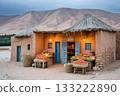 Small village grocery store selling fresh fruits and vegetables in desert oasis at dusk 133222890