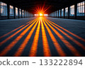 Golden sunlight creates stripes inside industrial building at sunrise 133222894