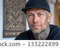 Tattooed man with artistic face and neck tattoos 133222899