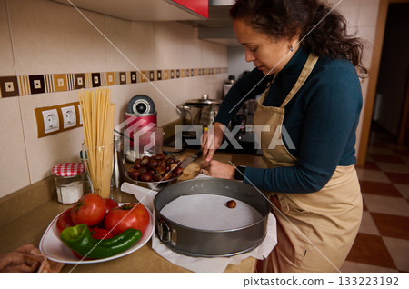 Woman In Apron Preparing Chocolate Treats In Kitchen For Dessert 133223192