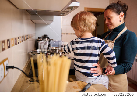 Mother And Child Cooking Together In Kitchen, Happy Home Moment 133223206
