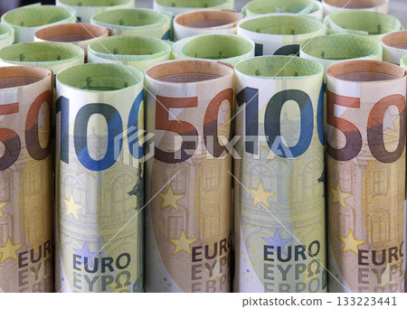 Rolls of euro banknotes as background. Rolls of euro banknotes as background. 133223441