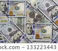 Hundred-dollar bills and some coins as background. Business concept. 133223443