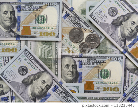 Hundred-dollar bills and some coins as background. Business concept. Hundred-dollar bills and some coins as background. Business concept. 133223443