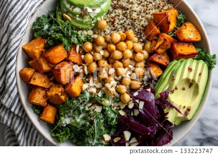 Healthy buddha bowl with roasted sweet potato and avocado 133223747