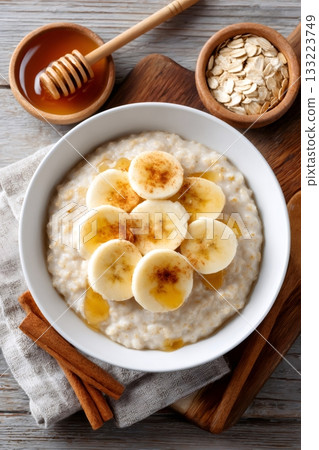 Oatmeal warming breakfast bowl with banana, honey, and cinnamon 133223749