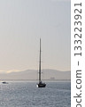 Sailing Yacht Underway Leaving Port At Dawn 133223921