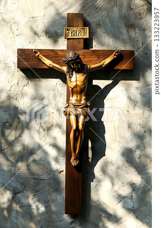 Wooden cross with a man on it 133223957