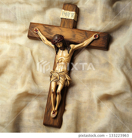 Wooden cross with a man on it, Jesus Christ, is laying on the cross Wooden cross with a man on it, Jesus Christ, is laying on the cross 133223963