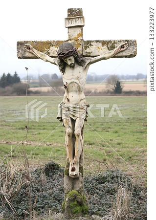 Cross with a statue of Jesus Christ on it Cross with a statue of Jesus Christ on it 133223977
