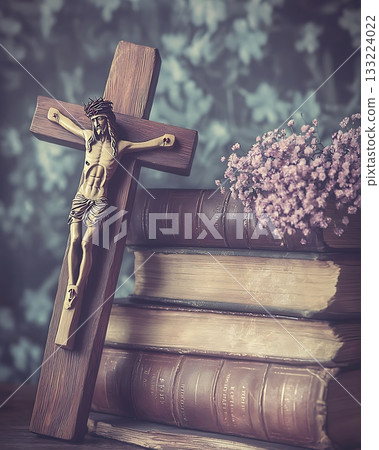 Cross is on top of a stack of books 133224022