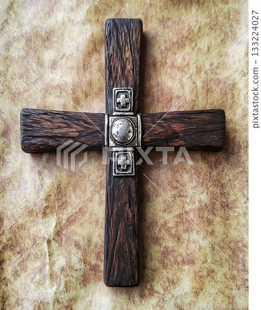 Wooden cross with a silver cross on it 133224027
