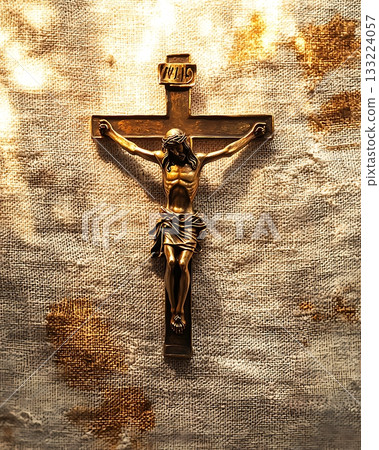 Gold cross with the name Jesus Christ on it 133224057