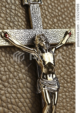 Gold cross with a man in the middle of it 133224098