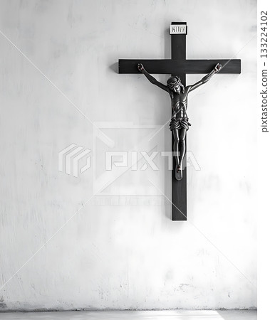 Crucifix is suspended from a wall Crucifix is suspended from a wall 133224102