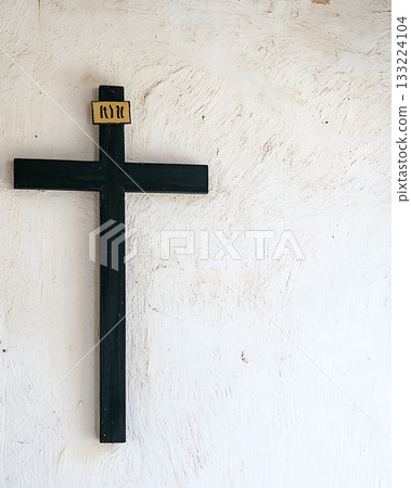 Cross with the letters RKM on it 133224104