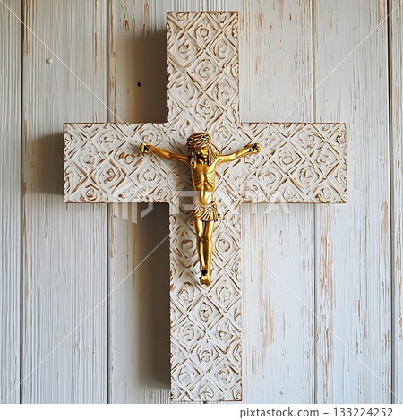 Gold cross with a figure of Jesus Christ on it 133224252