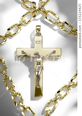 Gold cross with a man in the middle of it 133224425