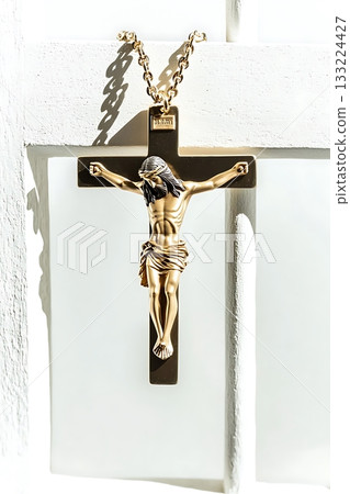 Gold cross with a man in the middle of it 133224427