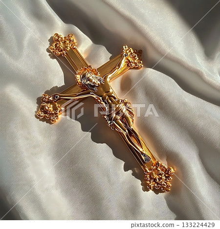 Gold cross with a man on it 133224429
