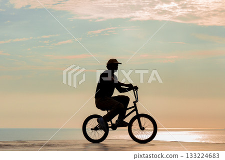 Freestyle cyclist practicing street BMX Freestyle cyclist practicing street BMX 133224683