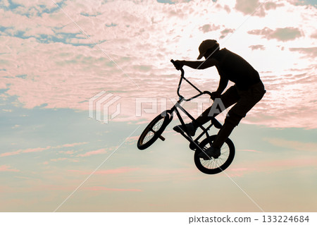 Freestyle cyclist practicing street BMX 133224684