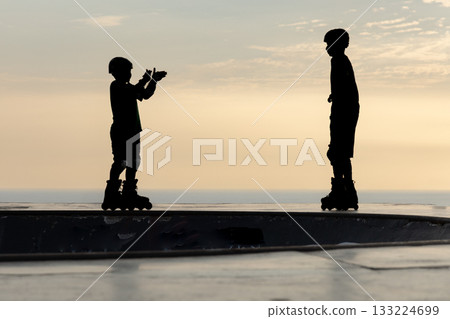 Freestyle skater practices with his roller skates 133224699